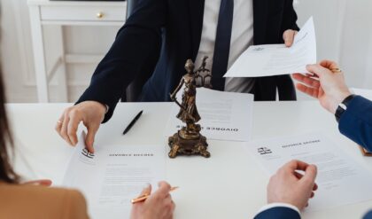 people holding divorce papers